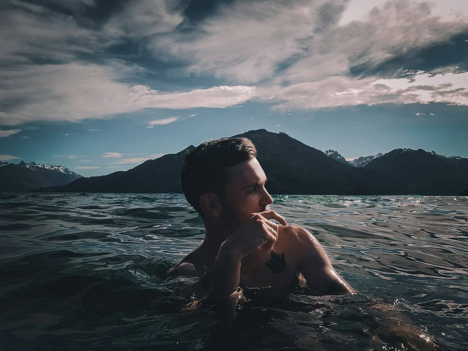 man swimming in sea